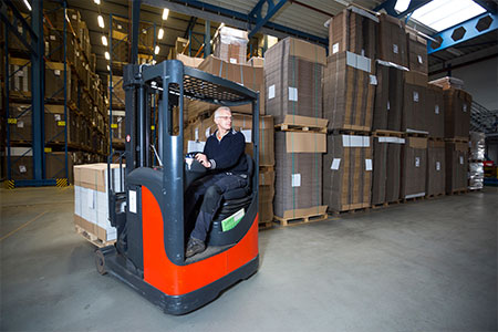 An industrial reach lift truck in a warehouse