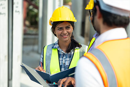 Two construction workers talking