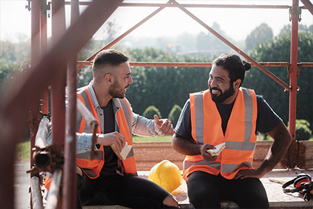 Two construction workers taking a break together