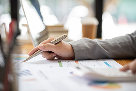 A person checking over files in an office