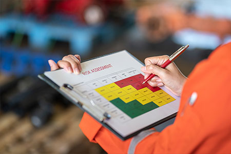 A person filling out a risk assessment