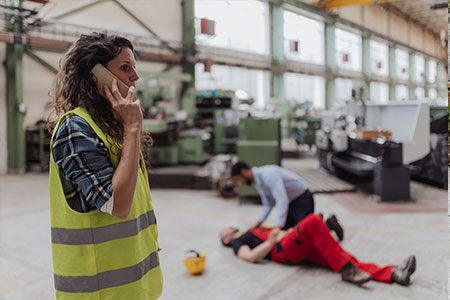 A woman reporting an injury on a building site