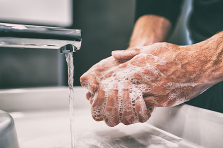 A person washing their hands