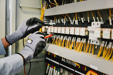 an electrician testing wiring