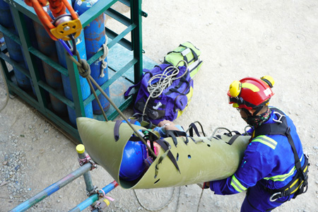 Rescuing a person from a crane using a harness