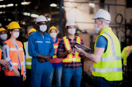 Construction manager talking with team