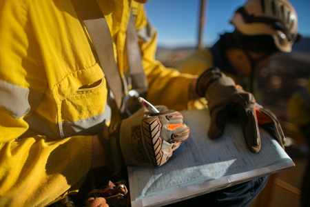 A person filling out a risk assessment 