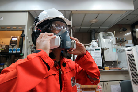 A construction worker wearing a face mask