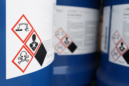 Close up of warning labels on chemical packaging