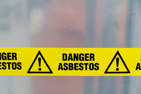 Asbestos warning on yellow tape