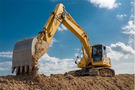 A 360 excavator digging a hole