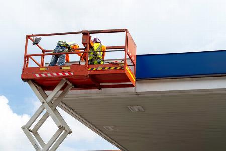 Construction workers on a scissor lift