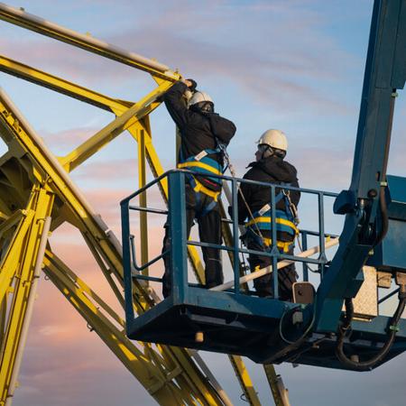 Two workers on a cherry picker